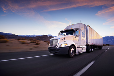 Dupre Logistics Freight Carriers Driving Down Road